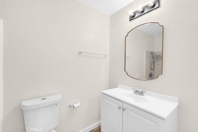 bathroom with toilet and vanity