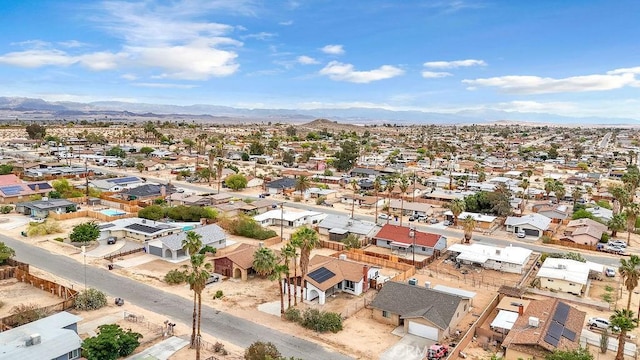 birds eye view of property with a mountain view and a residential view