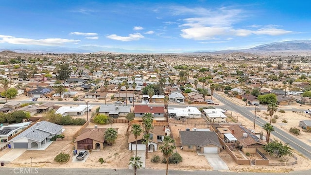 birds eye view of property with a mountain view and a residential view