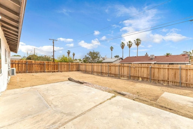 exterior space with a fenced backyard and a patio area