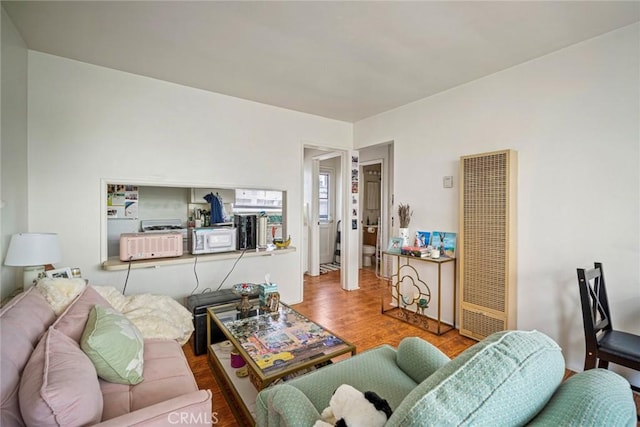 227 Avenida Santa Barbara, San Clemente, CA 92672 - living area with a heating unit and wood finished floors