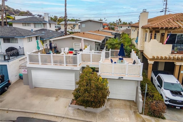 227 Avenida Santa Barbara, San Clemente, CA 92672 - view of front of house with an attached garage, concrete driveway, and a residential view