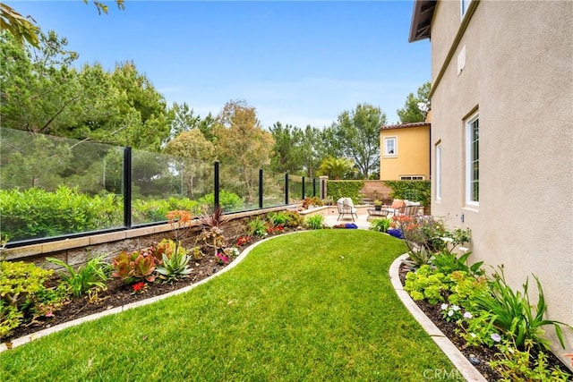 view of yard featuring a patio area and a fenced backyard