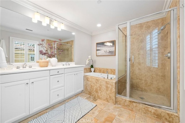 bathroom featuring a shower stall, a garden tub, double vanity, and a sink