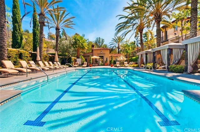 community pool with a patio area