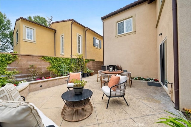 view of patio / terrace featuring outdoor dining area and fence