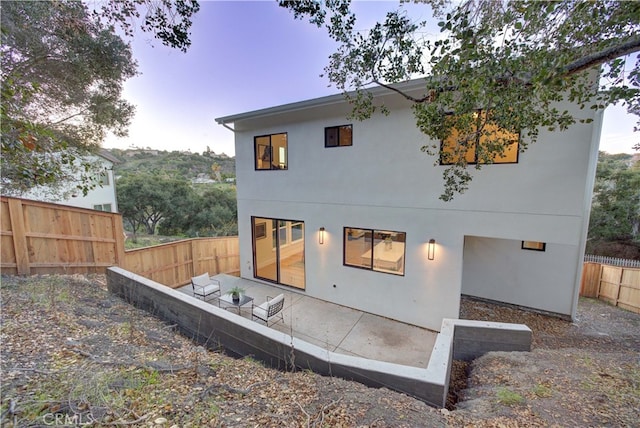 582 Paseo St, Arroyo Grande, CA 93420 - rear view of property with a fenced backyard, stucco siding, and a patio