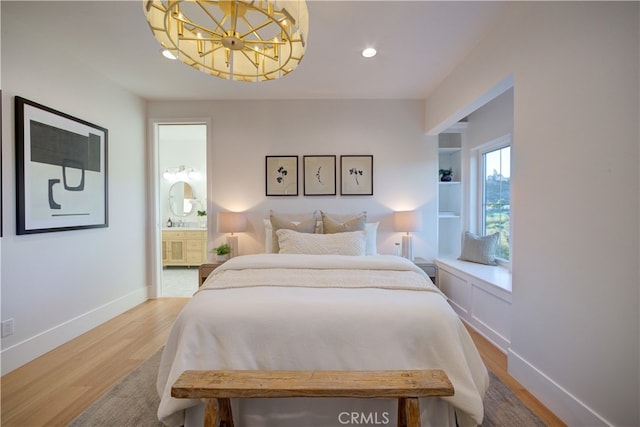 582 Paseo St, Arroyo Grande, CA 93420 - bedroom featuring wood finished floors, a chandelier, recessed lighting, baseboards, and ensuite bath