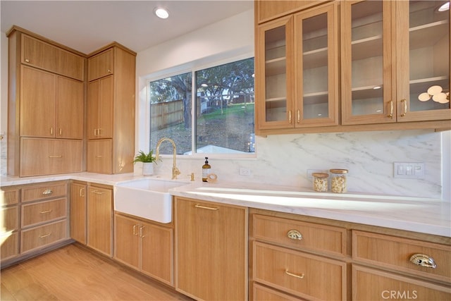 582 Paseo St, Arroyo Grande, CA 93420 - kitchen with a sink, light countertops, tasteful backsplash, and glass insert cabinets