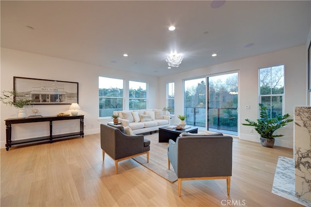 582 Paseo St, Arroyo Grande, CA 93420 - living room with light wood-style flooring, baseboards, healthy amount of natural light, recessed lighting, and a chandelier