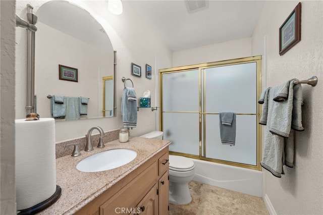 36608 Oak Ridge Dr, Yucaipa, CA 92399 - bathroom featuring vanity, toilet, and combined bath / shower with glass door