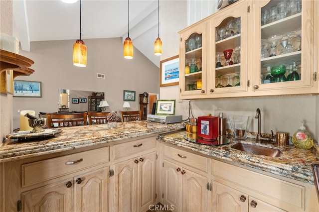 36608 Oak Ridge Dr, Yucaipa, CA 92399 - kitchen featuring a sink, glass insert cabinets, hanging light fixtures, and light stone countertops