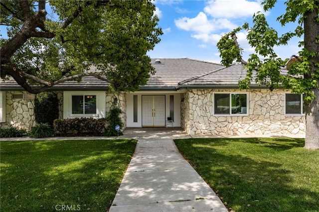 36608 Oak Ridge Dr, Yucaipa, CA 92399 - single story home with stone siding, french doors, and a front lawn