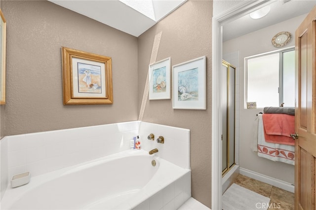 36608 Oak Ridge Dr, Yucaipa, CA 92399 - full bathroom with a shower stall, a garden tub, tile patterned flooring, and a textured wall