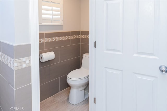 1624 Malden St, San Diego, CA 92109 - bathroom featuring tile walls, toilet, and wainscoting