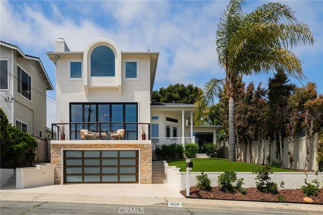 1624 Malden St, San Diego, CA 92109 - modern home with stucco siding, driveway, stone siding, an attached garage, and a chimney
