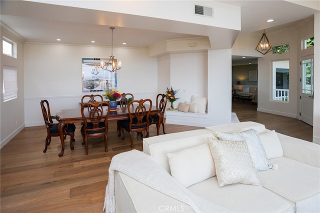 1624 Malden St, San Diego, CA 92109 - dining space featuring a chandelier, wood finished floors, recessed lighting, ornamental molding, and baseboards