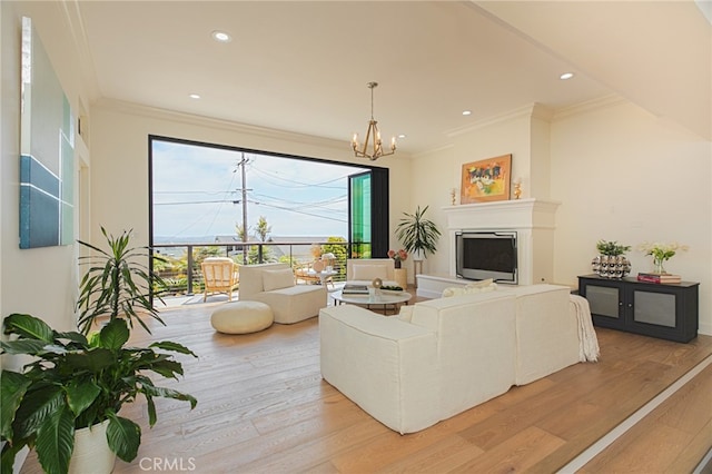 1624 Malden St, San Diego, CA 92109 - living room featuring a chandelier, light wood-style flooring, ornamental molding, recessed lighting, and a fireplace