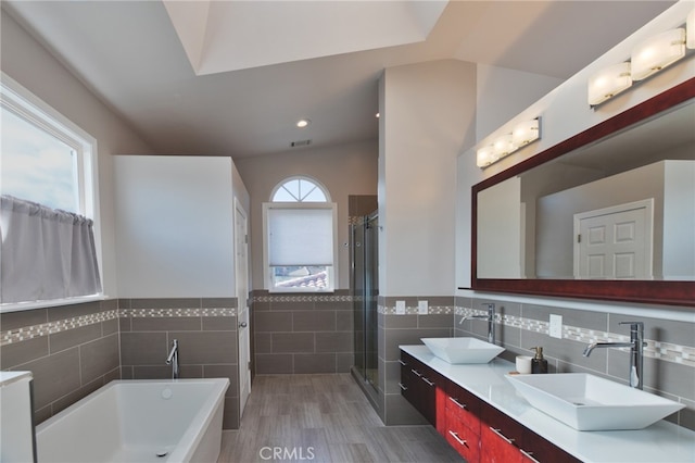 1624 Malden St, San Diego, CA 92109 - full bath with tile walls, double vanity, a bath, a stall shower, and a wainscoted wall
