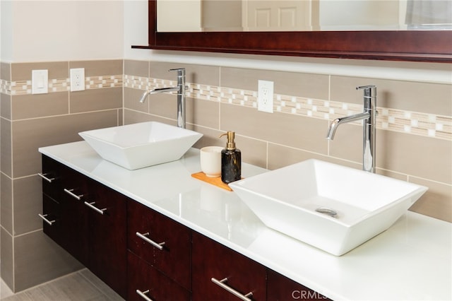 1624 Malden St, San Diego, CA 92109 - bathroom with double vanity, tile walls, and decorative backsplash