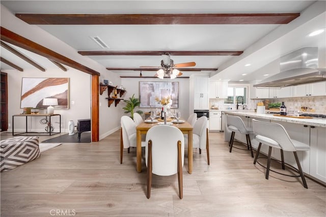 21128 Trigger Ln, Diamond Bar, CA 91765 - dining area with beam ceiling, light wood-type flooring, and baseboards