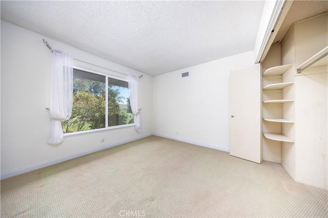 21128 Trigger Ln, Diamond Bar, CA 91765 - empty room featuring light colored carpet, a textured ceiling, and baseboards