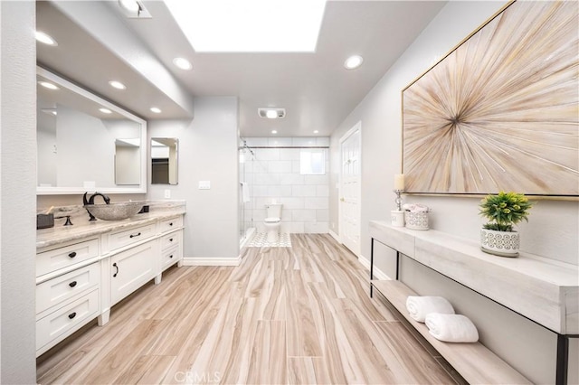 21128 Trigger Ln, Diamond Bar, CA 91765 - full bath featuring a shower stall, vanity, recessed lighting, baseboards, and wood finished floors