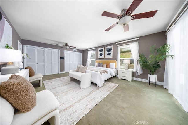21128 Trigger Ln, Diamond Bar, CA 91765 - bedroom featuring multiple closets, light carpet, baseboards, and a ceiling fan