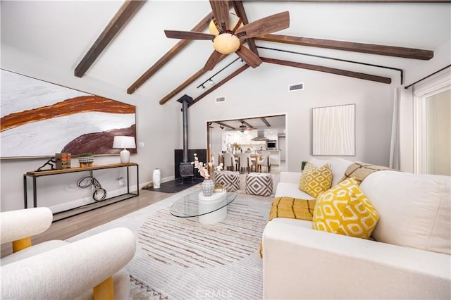 21128 Trigger Ln, Diamond Bar, CA 91765 - living area featuring a wood stove, a ceiling fan, wood finished floors, and baseboards