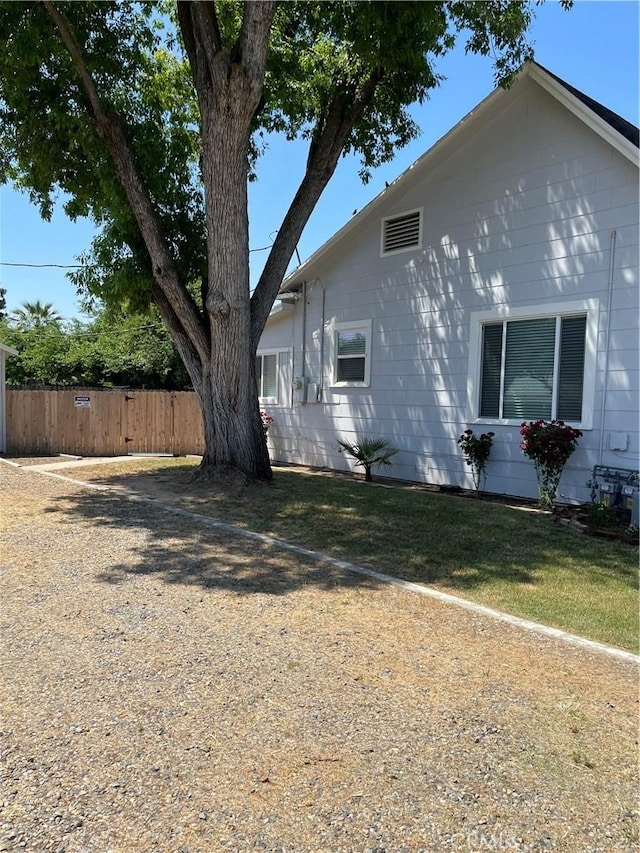 view of property exterior with fence