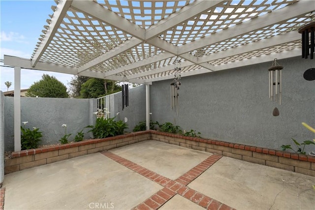 view of patio / terrace featuring a pergola and a fenced backyard