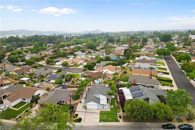 birds eye view of property with a residential view and a mountain view