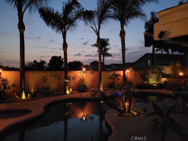 view of pool featuring fence and a patio area