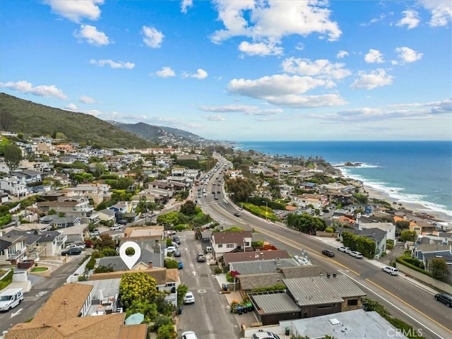 bird's eye view with a water and mountain view and a residential view