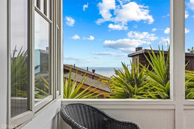 balcony featuring a water view