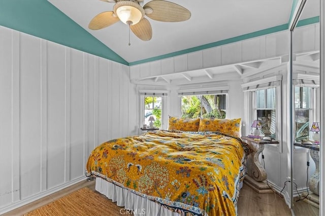 bedroom featuring vaulted ceiling, ceiling fan, and wood finished floors