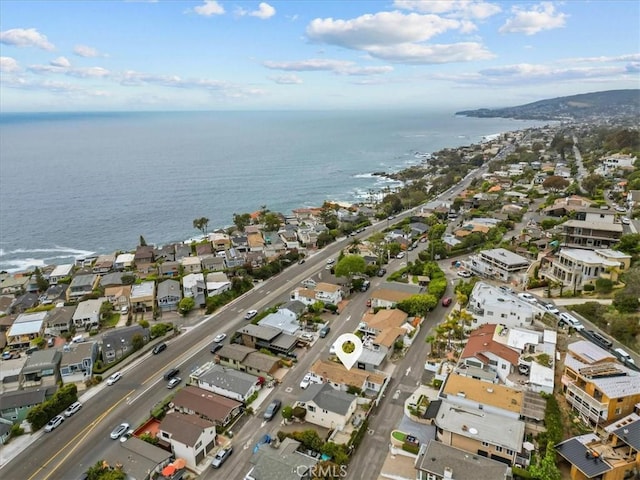 drone / aerial view featuring a water view and a residential view