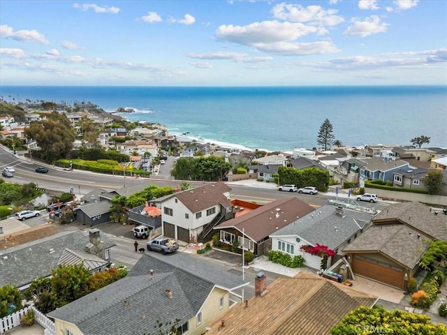 birds eye view of property with a water view and a residential view