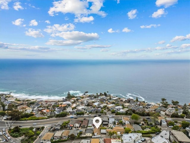 drone / aerial view with a water view and a residential view