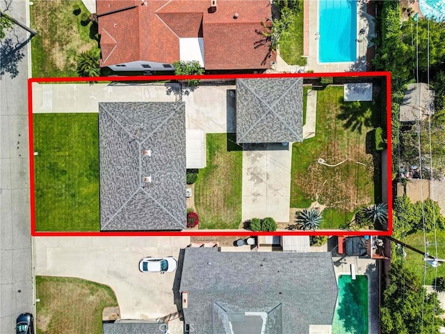 aerial view of property and surrounding area with a pool and property boundaries highlighted