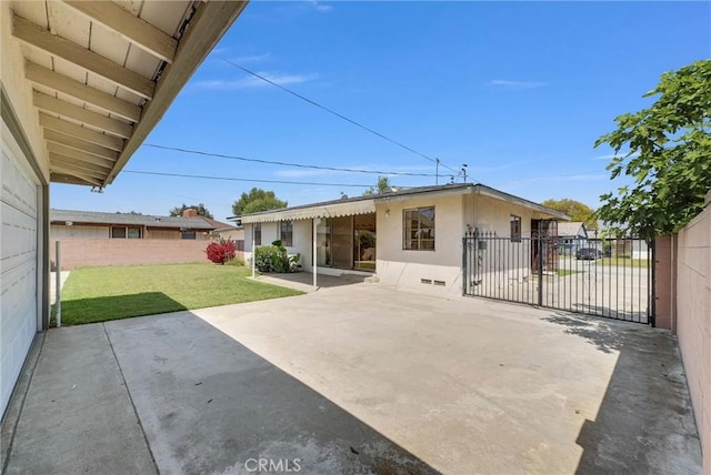 back of property with a patio