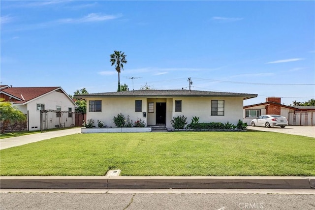 ranch-style home with stucco siding and driveway