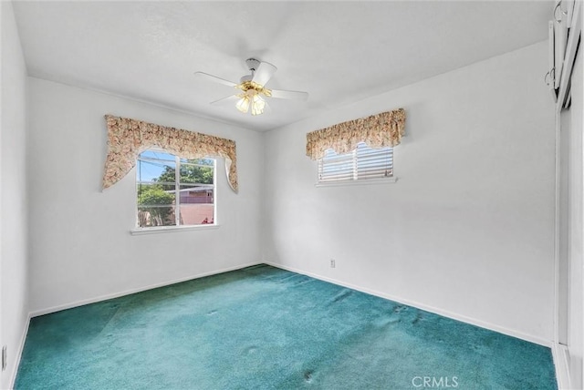 unfurnished room featuring carpet floors, ceiling fan, and baseboards