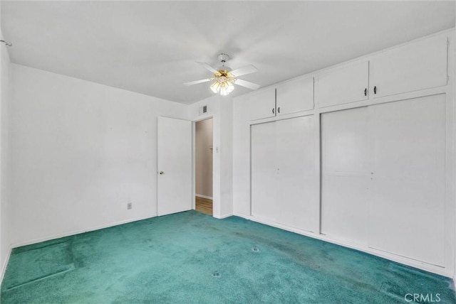unfurnished bedroom with carpet flooring and a ceiling fan