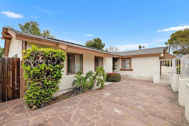 6552 Mallard St, San Diego, CA 92114 - rear view of property with stucco siding and a patio