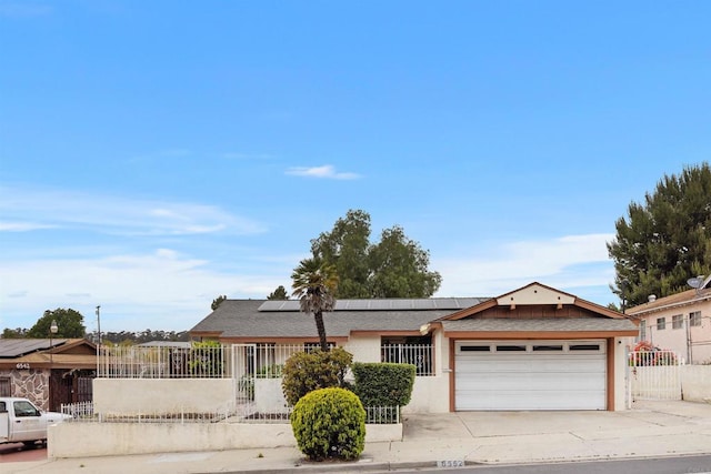 6552 Mallard St, San Diego, CA 92114 - ranch-style home with an attached garage, roof mounted solar panels, driveway, and stucco siding