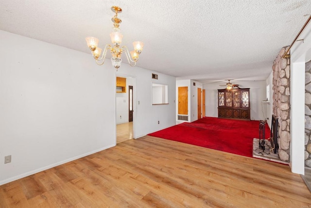 6552 Mallard St, San Diego, CA 92114 - unfurnished living room with wood finished floors, a textured ceiling, a chandelier, ceiling fan, and baseboards