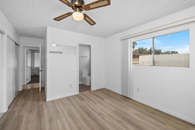 6552 Mallard St, San Diego, CA 92114 - unfurnished bedroom with light wood finished floors, a textured ceiling, ensuite bathroom, baseboards, and ceiling fan