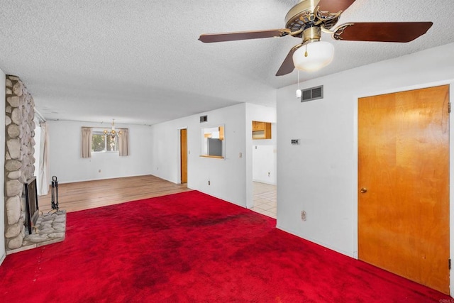 6552 Mallard St, San Diego, CA 92114 - unfurnished living room featuring a textured ceiling, a fireplace, ceiling fan, and carpet