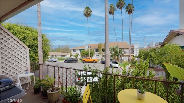 balcony featuring a porch and a residential view